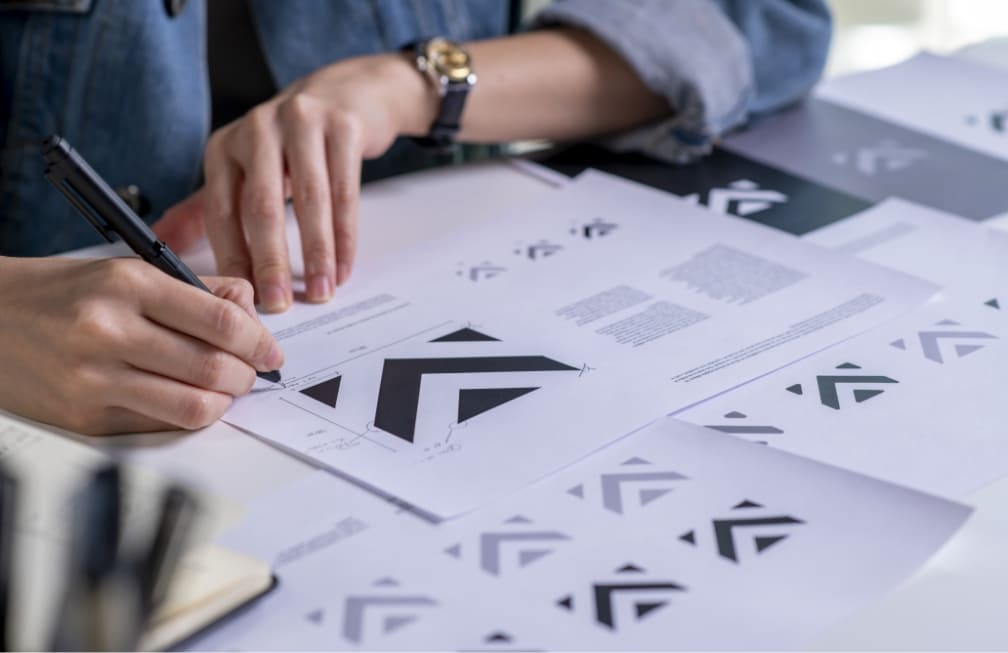 graphic-designer-drawing-sketches-logo-design-concept-new-brand-professional-creative-occupation-with-idea